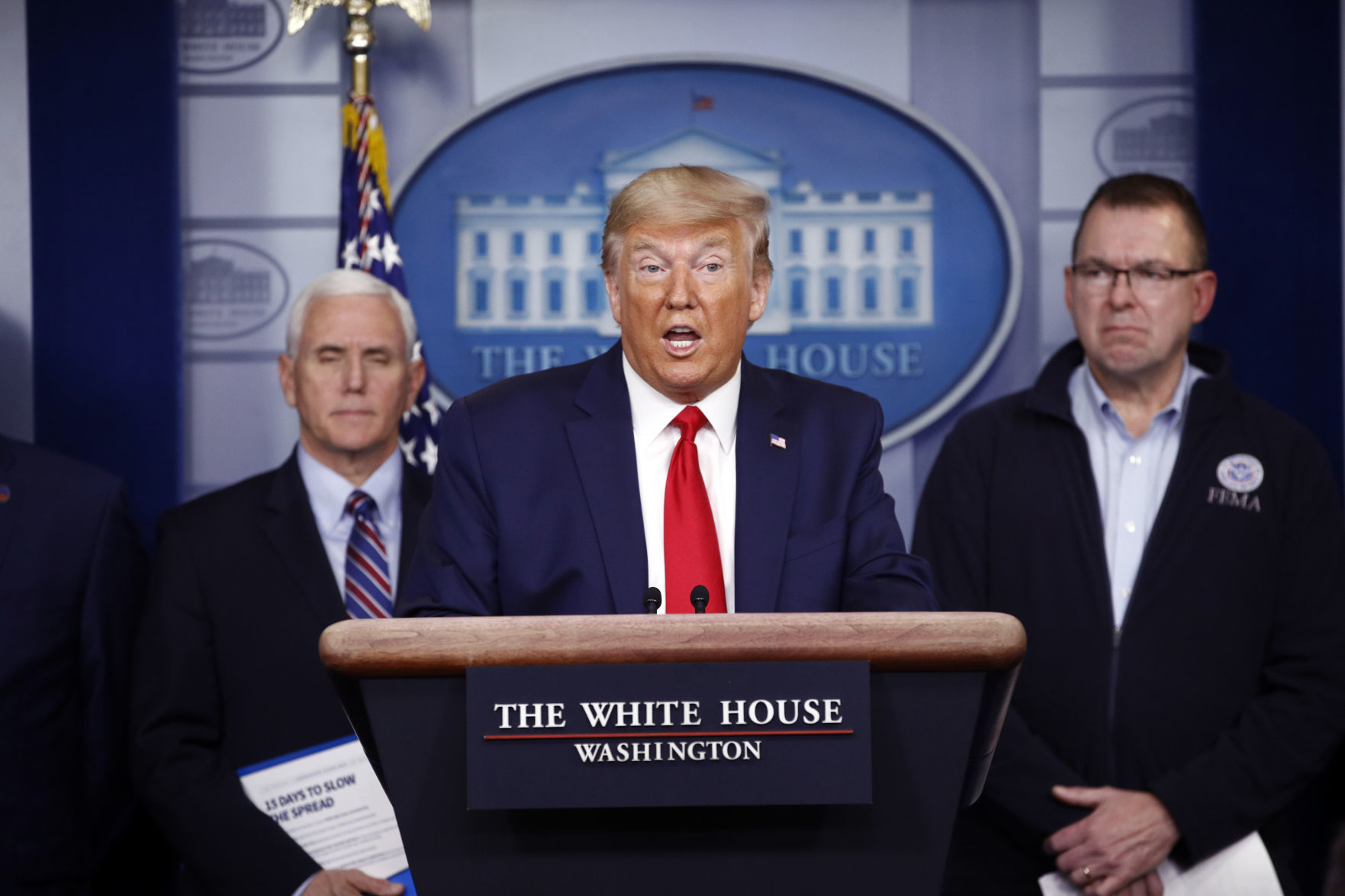 TRUMP-PRITZKER CLASH